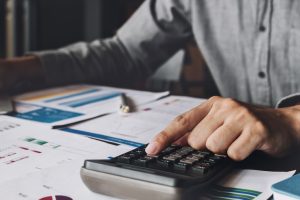 A man is busy preparing his year-end financial report.