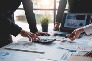 A business owner doing a financial forecasting to reduce business risks.