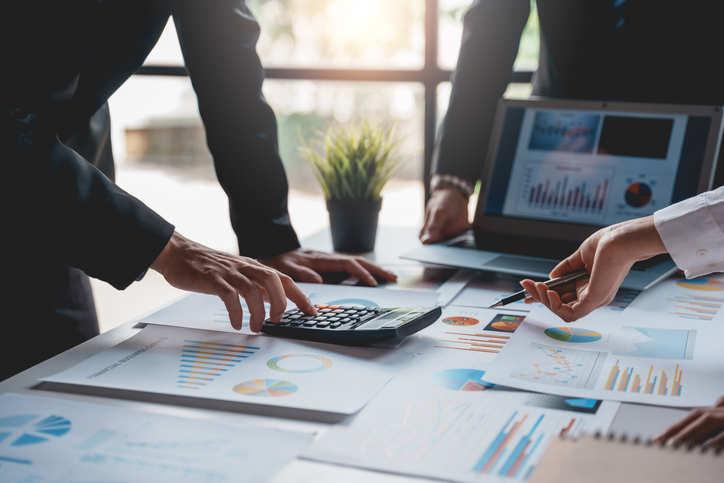A business owner doing a financial forecasting to reduce business risks.