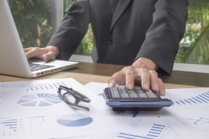 An accountant making a correction for a common accounting or bookkeeping business mistake.