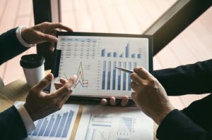 A business owner is leveraging data analytics for smarter decisions that drive progress and innovation through insights.
