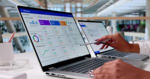 A business professional reviewing financial dashboards on cloud-based accounting software using a laptop.