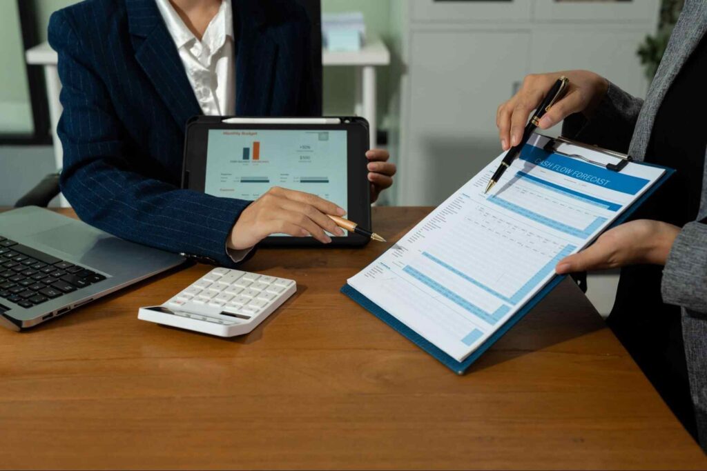 Accounting professionals reviewing financial reports for business strategy accounting firm Canada.