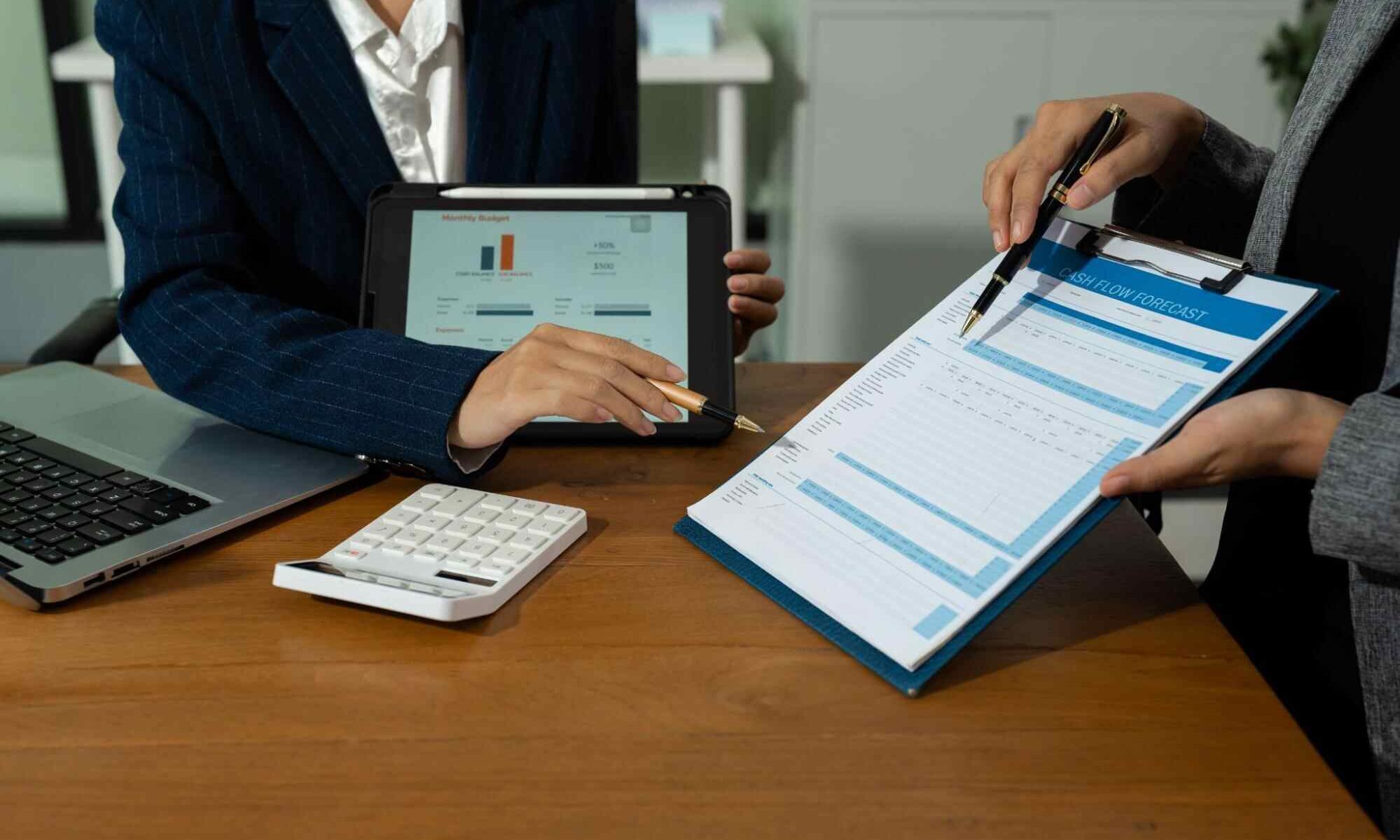 Accounting professionals reviewing financial reports for business strategy accounting firm Canada.