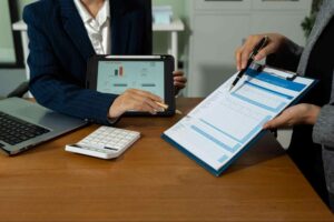 Accounting professionals reviewing financial reports for business strategy accounting firm Canada.